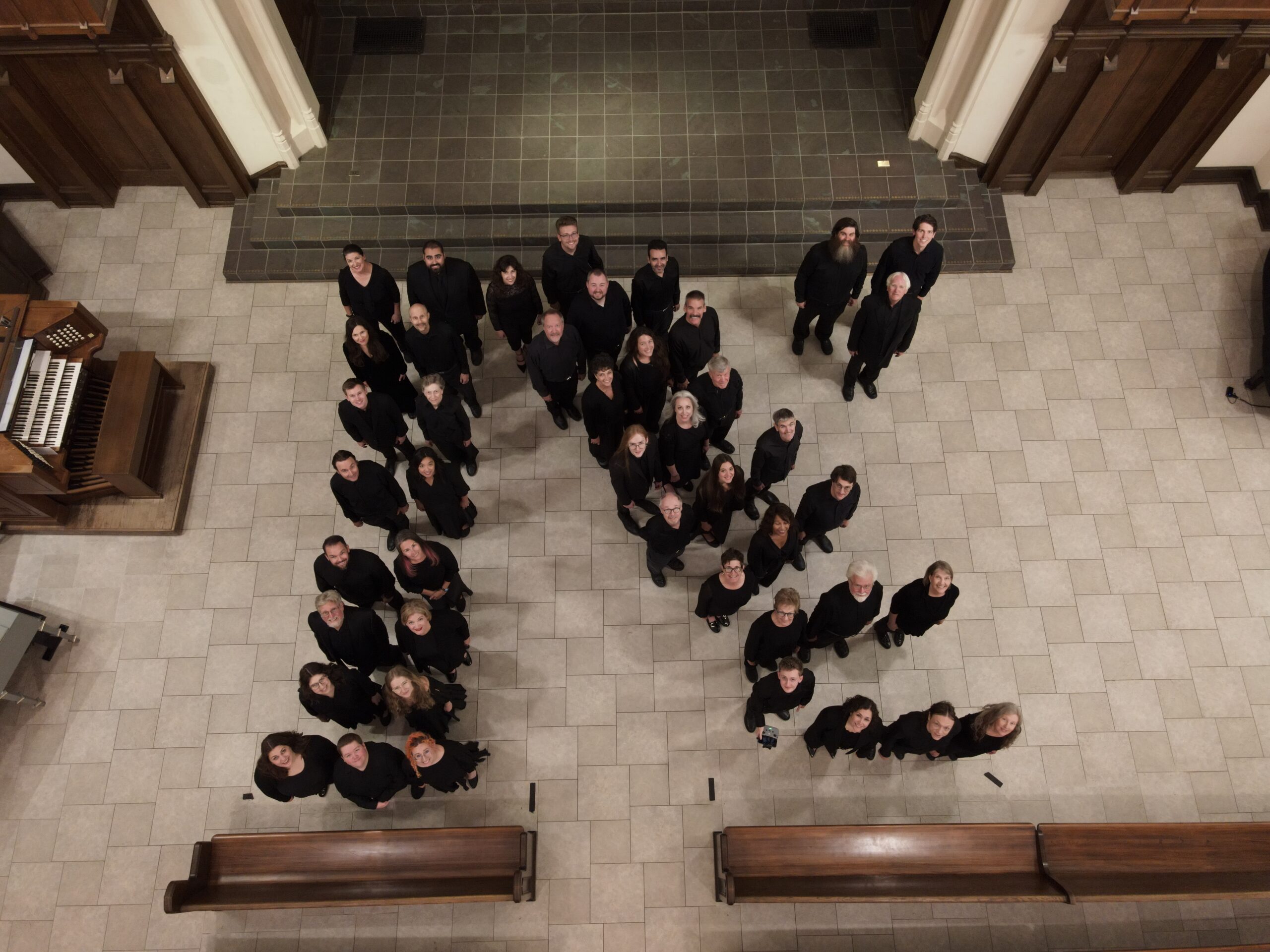 Overhead drone view of the Ars Nova Singers standing in the shape of the letter N